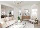 Inviting living room with an open floor plan, featuring a stylish coffee table and neutral-toned furniture at 711 Alma Square Dr, Moncks Corner, SC 29461