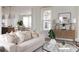 Bright and airy living room featuring modern decor, plush seating, and stylish accents at 711 Alma Square Dr, Moncks Corner, SC 29461