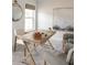 Bright home office featuring a vintage wooden desk, patterned wallpaper, and modern decor at 711 Alma Square Dr, Moncks Corner, SC 29461