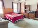 Bright bedroom featuring natural light and wooden furniture at 715 Hampton St, Walterboro, SC 29488