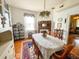 Bright dining room with hardwood floors and beautiful chandelier at 715 Hampton St, Walterboro, SC 29488