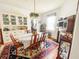 Bright dining room with hardwood floors and beautiful chandelier at 715 Hampton St, Walterboro, SC 29488