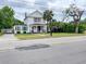 Charming two-story home with well-maintained lawn and covered front porch with classic curb appeal at 715 Hampton St, Walterboro, SC 29488
