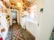 Vintage laundry room featuring a washer and dryer hook up and decorative woven baskets on the walls at 715 Hampton St, Walterboro, SC 29488