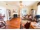 Open living room with hardwood floors, fireplace, and french doors at 715 Hampton St, Walterboro, SC 29488