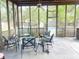 Inviting screened-in patio with comfortable seating and view of the backyard pool at 715 Hampton St, Walterboro, SC 29488