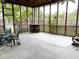 Cozy screened-in patio with outdoor seating and a built-in bar area at 715 Hampton St, Walterboro, SC 29488