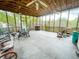 Spacious screened-in patio with ceiling fans and outdoor furniture at 715 Hampton St, Walterboro, SC 29488