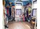 Spacious walk-in closet with hardwood floors, ample shelving, and hanging storage at 715 Hampton St, Walterboro, SC 29488