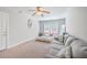Bright bedroom with a ceiling fan, natural light and neutral decor at 7791 Peppercorn Ln, North Charleston, SC 29420
