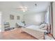 Spacious bedroom with neutral walls, carpeted flooring, and a large window at 7791 Peppercorn Ln, North Charleston, SC 29420