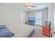Bedroom featuring neutral walls, ceiling fan, carpeted flooring, and a window with blinds at 7791 Peppercorn Ln, North Charleston, SC 29420