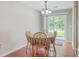 Dining room with wood table, chandelier, and sliding door access to the backyard at 7791 Peppercorn Ln, North Charleston, SC 29420