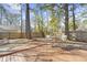 Cozy backyard featuring a wooden deck with outdoor seating, offering a private space for relaxation at 7932 Riverbirch Ln, North Charleston, SC 29418