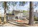 Backyard of the house, featuring a wooden deck with outdoor seating at 7932 Riverbirch Ln, North Charleston, SC 29418