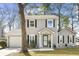 Charming two-story home at 7932 boasts tidy landscaping, complemented by black window shutters at 7932 Riverbirch Ln, North Charleston, SC 29418