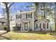 Charming two-story home at 7932 boasts tidy landscaping, complemented by black window shutters at 7932 Riverbirch Ln, North Charleston, SC 29418