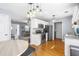 Open-concept kitchen featuring stainless steel appliances and hardwood floors at 7932 Riverbirch Ln, North Charleston, SC 29418
