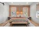 Well-appointed bedroom featuring a wood accent wall, with recessed lighting and stylish decor at 8067 Jack Island Dr, Johns Island, SC 29455
