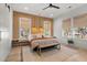 This modern bedroom has a wooden accent wall, wood floors, and stylish furnishings for a relaxing retreat at 8067 Jack Island Dr, Johns Island, SC 29455