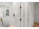 Bright hallway showcasing a door with keyless entry and view out a window at 8067 Jack Island Dr, Johns Island, SC 29455