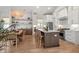 Open kitchen with a center island, stainless steel appliances, and a dining table at 8067 Jack Island Dr, Johns Island, SC 29455
