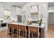 Modern kitchen with a large island, white cabinets, and stainless steel appliances at 8067 Jack Island Dr, Johns Island, SC 29455