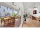 This bright living area has a beautiful porch through sliding doors and an open floor plan to the living room at 8067 Jack Island Dr, Johns Island, SC 29455