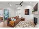 Cozy living room with leather sofa, fireplace, and access to the outdoors at 8067 Jack Island Dr, Johns Island, SC 29455