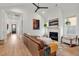 Bright living room with fireplace, hardwood floors, and stylish furnishings at 8067 Jack Island Dr, Johns Island, SC 29455