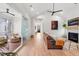 Spacious living room with sliding doors to outdoor space and fireplace at 8067 Jack Island Dr, Johns Island, SC 29455