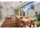 Covered patio with a dining table and swing offers an inviting outdoor space at 8067 Jack Island Dr, Johns Island, SC 29455