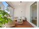 Inviting outdoor porch with a cozy seating area and wood flooring, perfect for relaxing or entertaining guests at 8067 Jack Island Dr, Johns Island, SC 29455