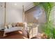 Cozy porch features a swing seat and a comfortable chair, perfect for relaxing outdoors at 8067 Jack Island Dr, Johns Island, SC 29455