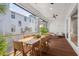 Covered porch with dining and relaxing seating, complete with wood flooring and views of the neighbourhood at 8067 Jack Island Dr, Johns Island, SC 29455