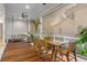 Relaxing outdoor porch features a dining table and a porch swing with views of the neighborhood at 8067 Jack Island Dr, Johns Island, SC 29455