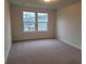 Bedroom with carpeted floor and double windows letting in plenty of light at 818 Descartes St, Summerville, SC 29486
