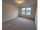 Bedroom with carpeted floor and double windows allowing for natural light at 818 Descartes St, Summerville, SC 29486