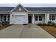 Charming one-story home with a single-car garage and a well-manicured front yard on a sunny day at 818 Descartes St, Summerville, SC 29486