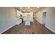 Spacious and bright open-concept kitchen and living area with hardwood floors and modern stainless steel appliances at 818 Descartes St, Summerville, SC 29486