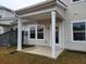Covered patio with white columns, door, and windows at 818 Descartes St, Summerville, SC 29486