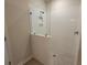 New bathroom featuring a tile shower with glass partition and built in shelf at 818 Descartes St, Summerville, SC 29486
