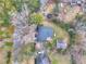 Aerial view of a home featuring a backyard deck, mature trees, and a detached garage at 847 Quail Dr, Charleston, SC 29412