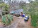 Aerial view of a home featuring a back deck and mature trees in a neighborhood at 847 Quail Dr, Charleston, SC 29412