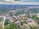 An aerial shot shows a charming neighborhood surrounded by lush trees and a tranquil waterway at 847 Quail Dr, Charleston, SC 29412