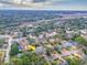 An aerial shot shows a charming neighborhood surrounded by lush trees and a tranquil waterway at 847 Quail Dr, Charleston, SC 29412