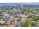 An aerial view of a home in a well-established neighborhood with mature trees and a nearby waterway at 847 Quail Dr, Charleston, SC 29412