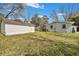 Backyard view showcasing a storage shed, grassy area, and deck with outdoor seating at 847 Quail Dr, Charleston, SC 29412