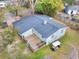Aerial backyard view showing the deck, patio furniture, golf cart, and wooded landscape at 847 Quail Dr, Charleston, SC 29412