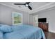 Bright bedroom with a ceiling fan, a window, and a TV, creating a relaxing and functional space at 847 Quail Dr, Charleston, SC 29412